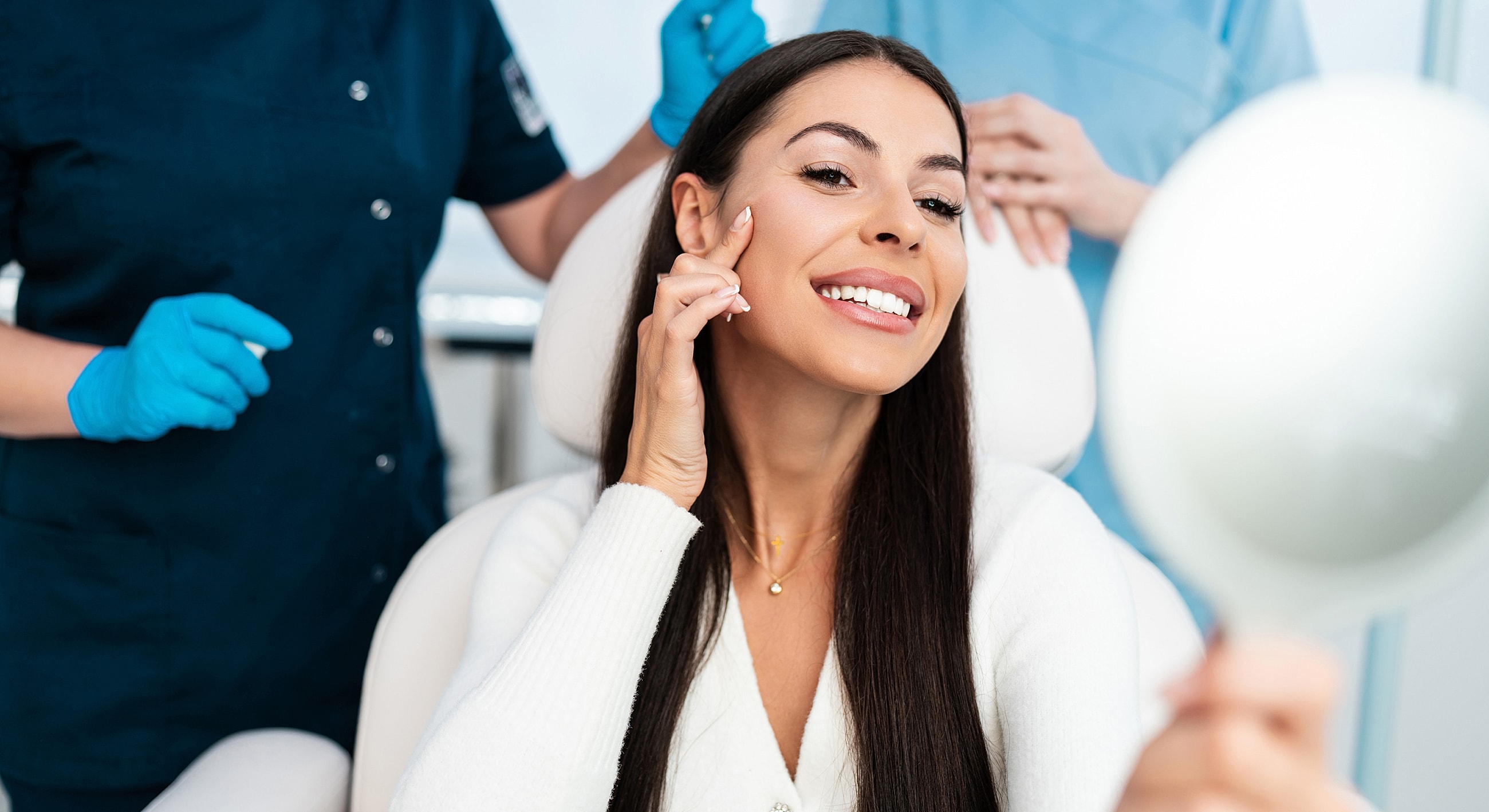 Patient smiling at cosmetic treatment in clinic.